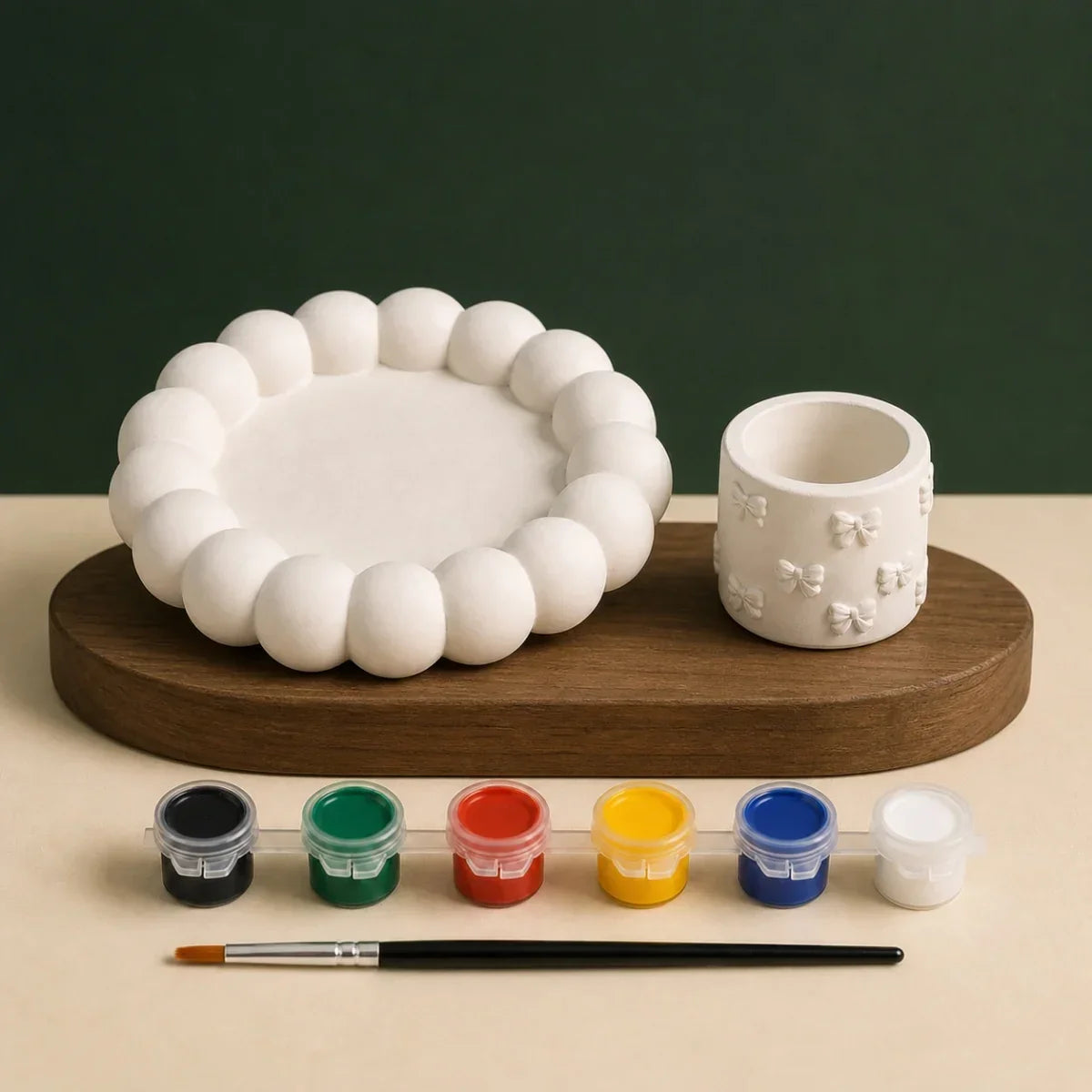 Unpainted bubble tray and bow holder with six paint colours and one brush for a paint-at-home date night