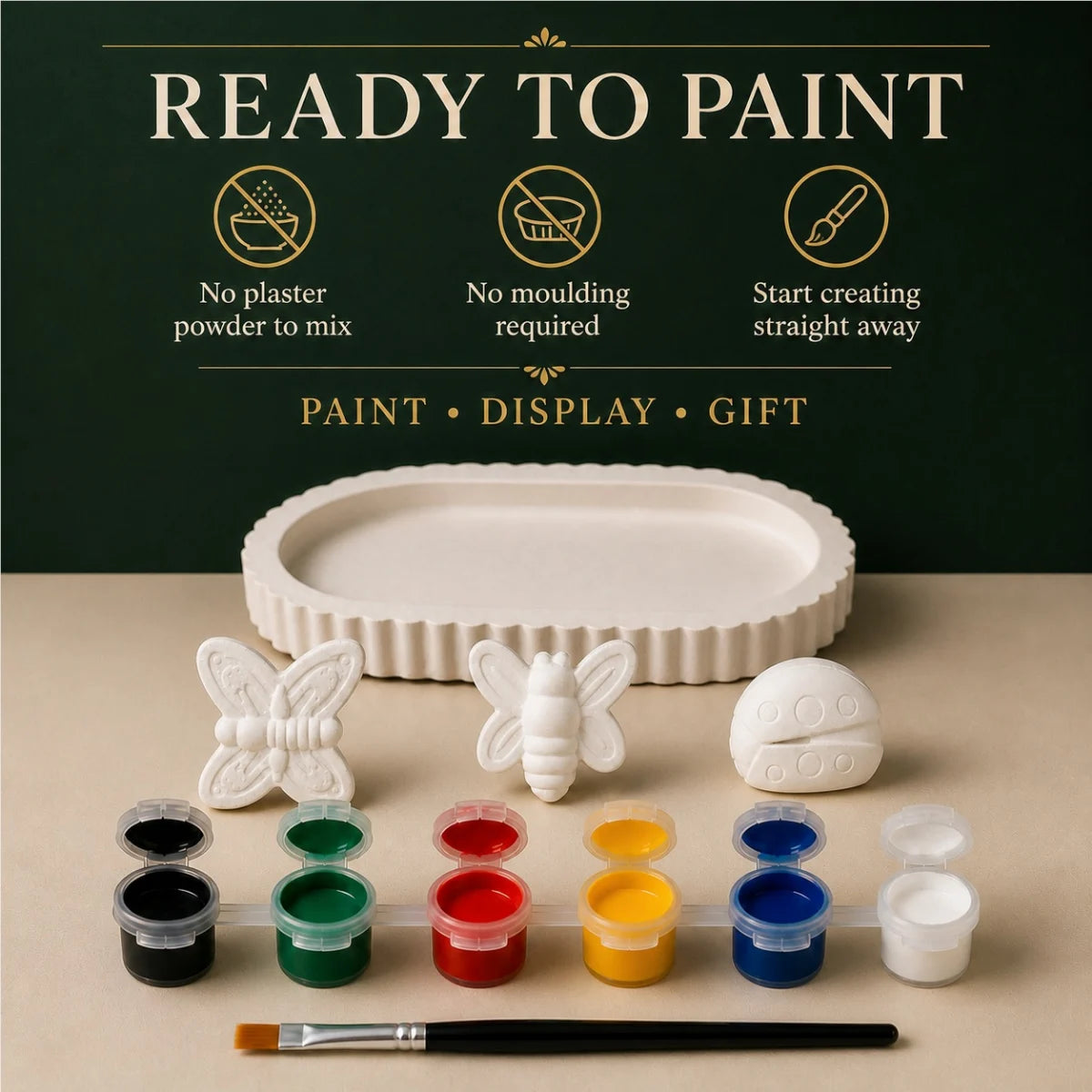 The pieces being painted at a table
