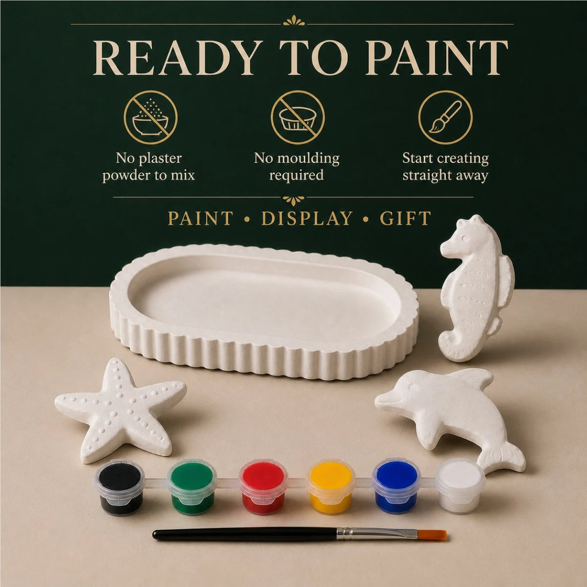 The pieces being painted at a table