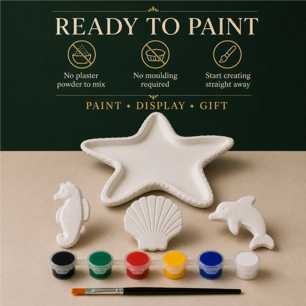 The pieces being painted at a table