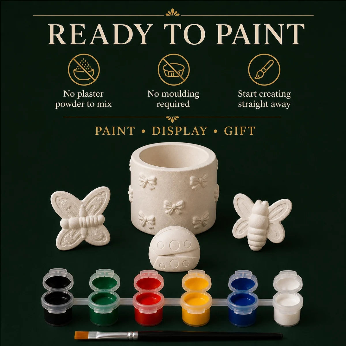 The pieces being painted at a table