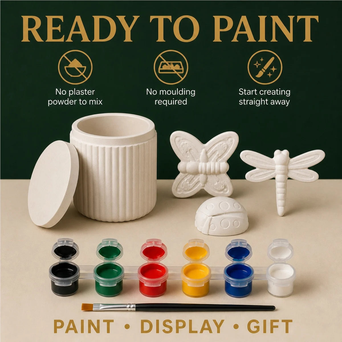 The pieces being painted at a table