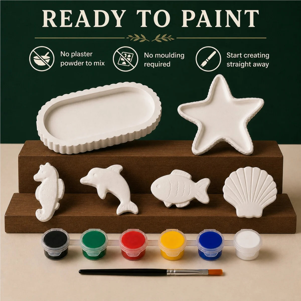 The pieces being painted at a table