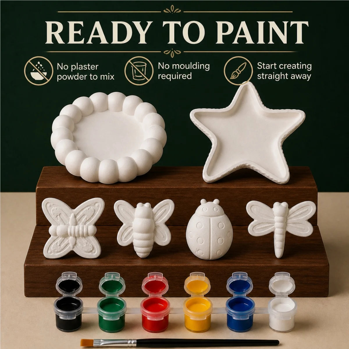 The pieces being painted at a table