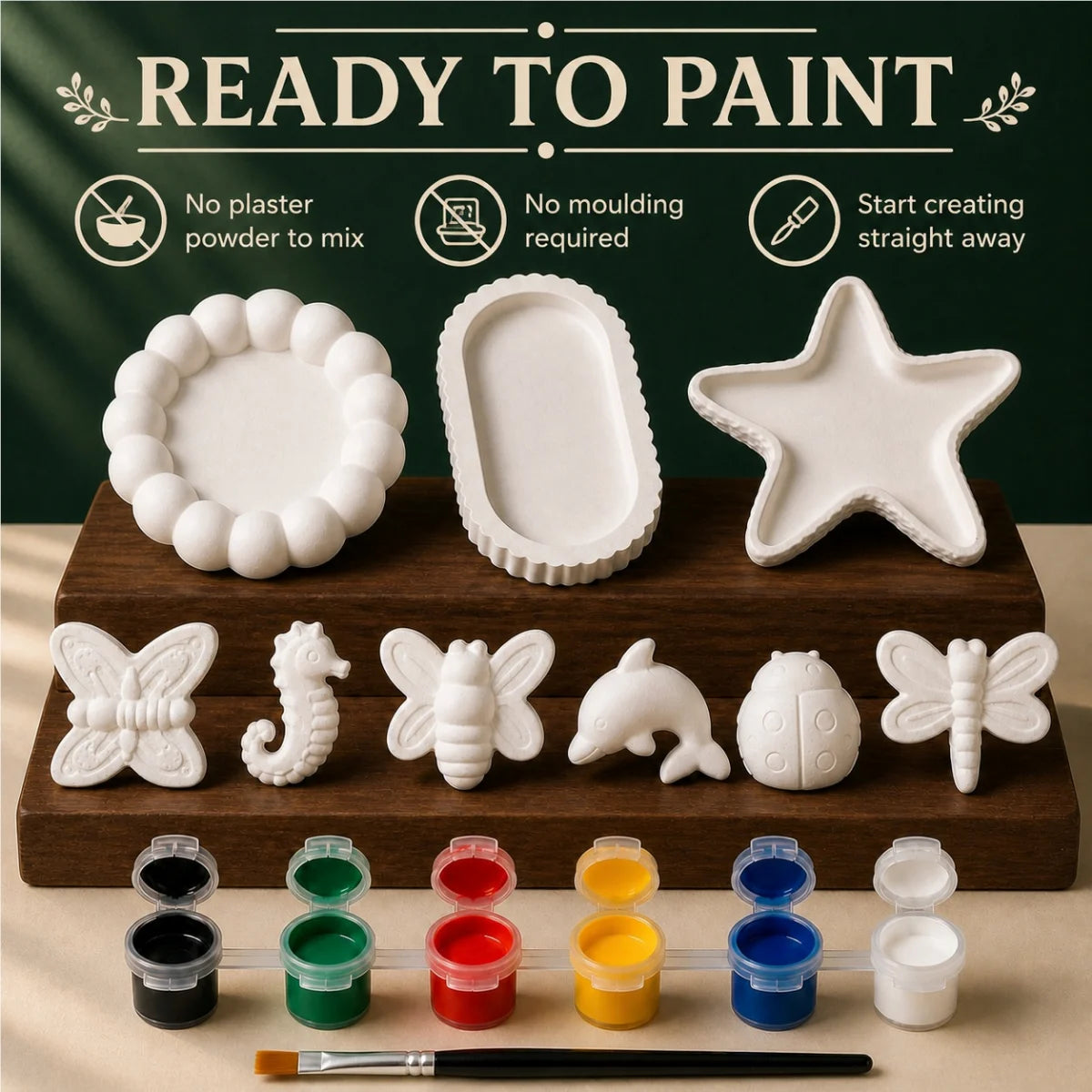 The pieces being painted at a table