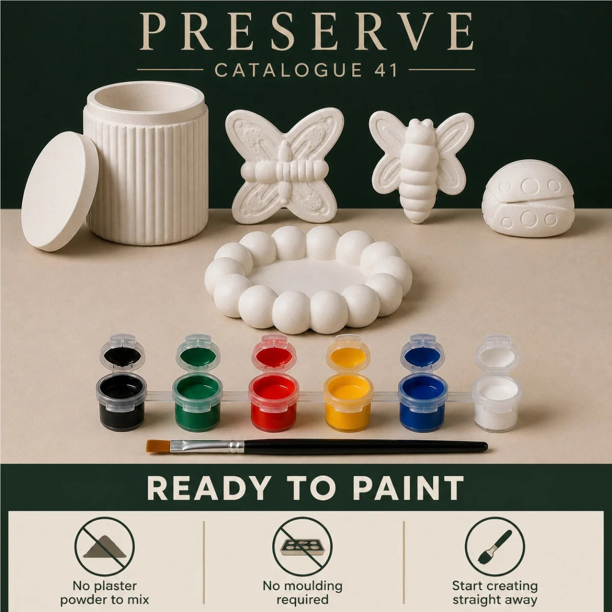 The pieces being painted at a table