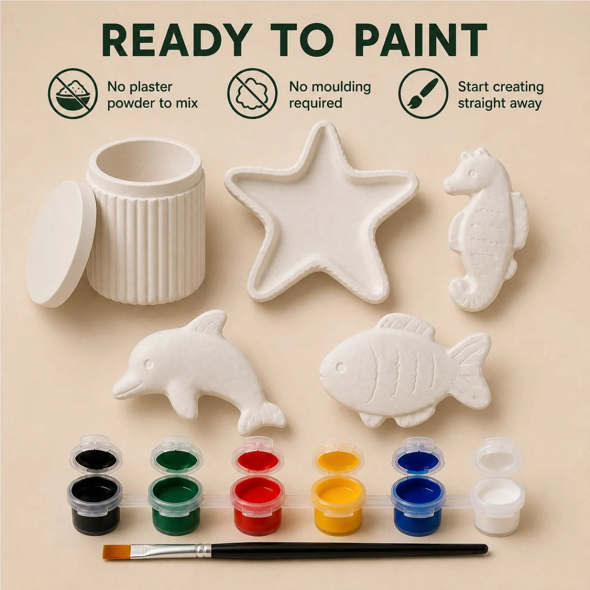 The pieces being painted at a table
