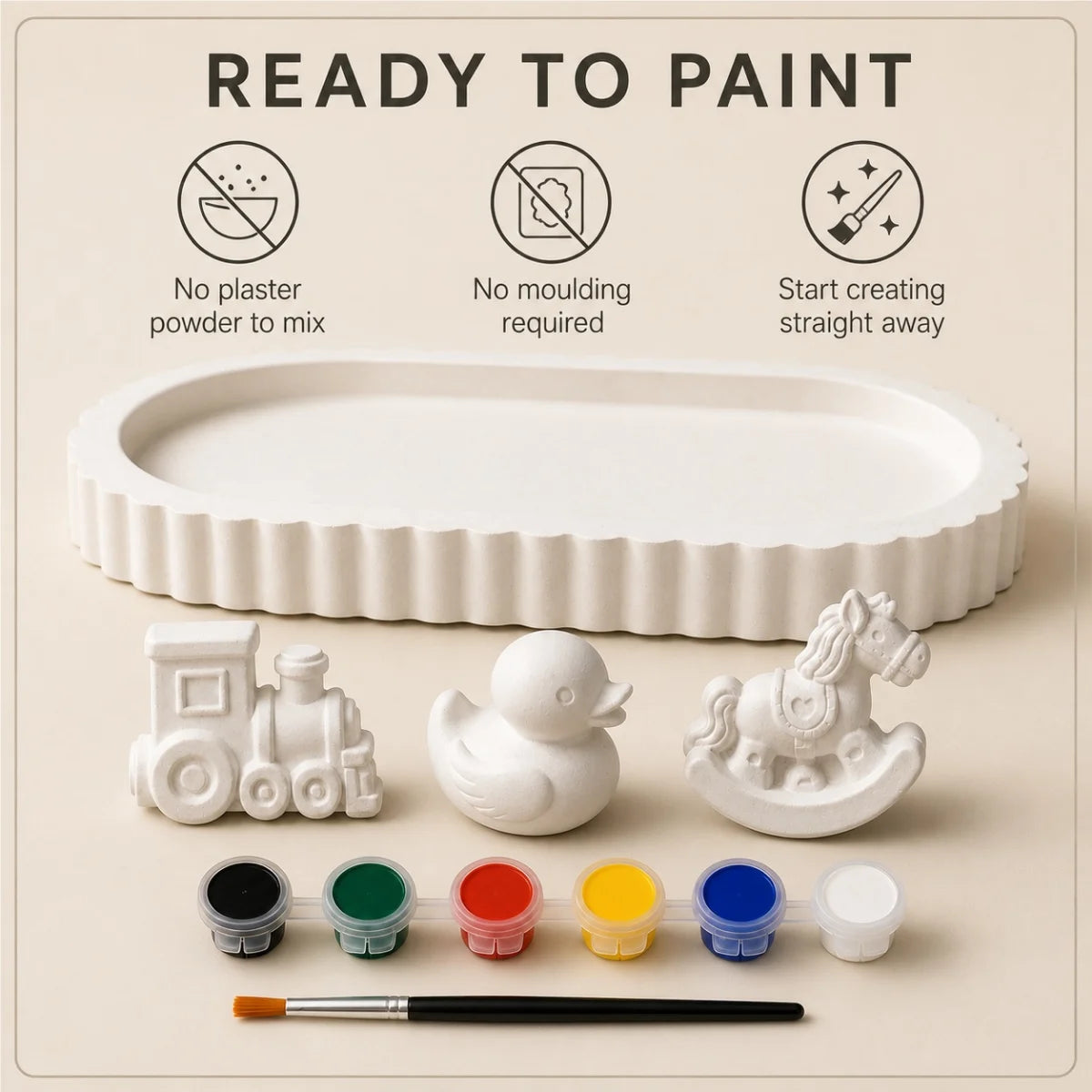 The pieces being painted at a table