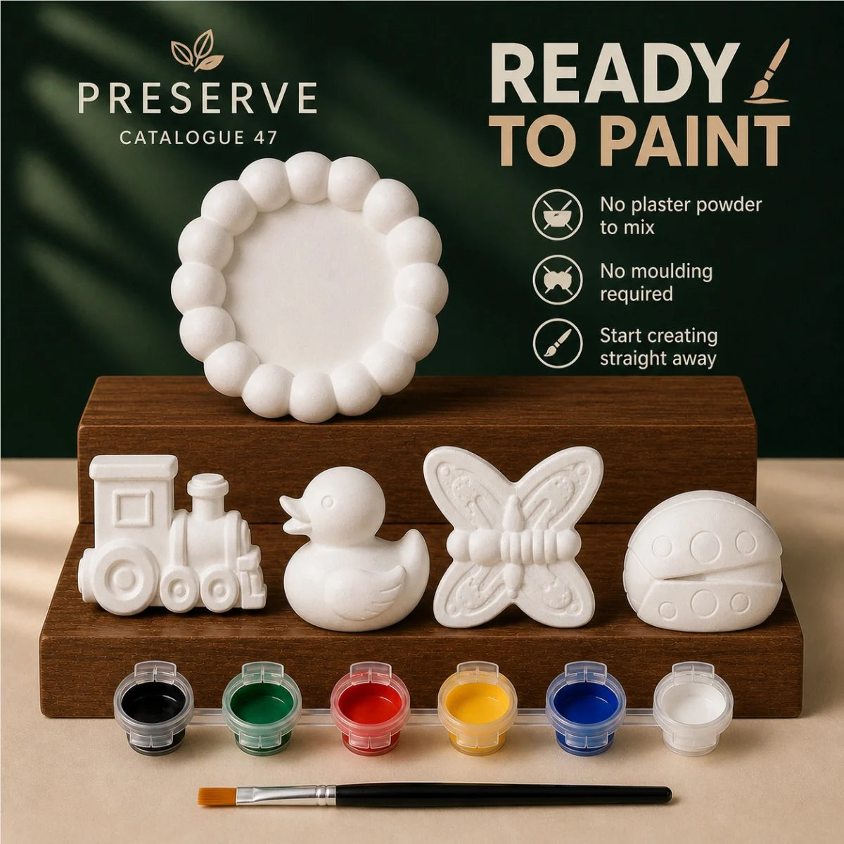 The pieces being painted at a table