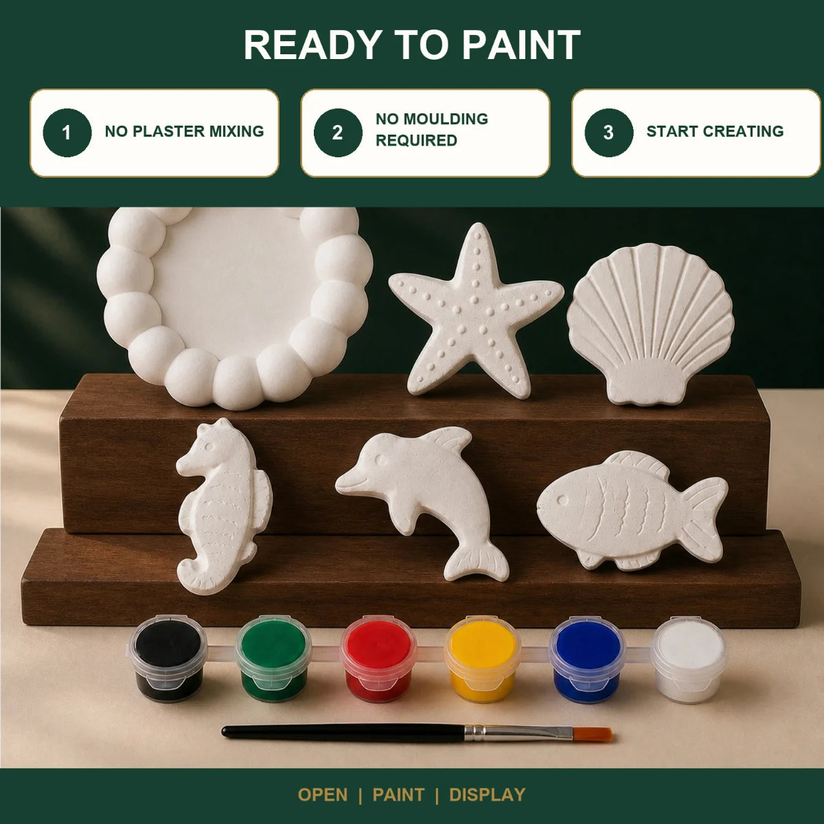 The pieces being painted at a table