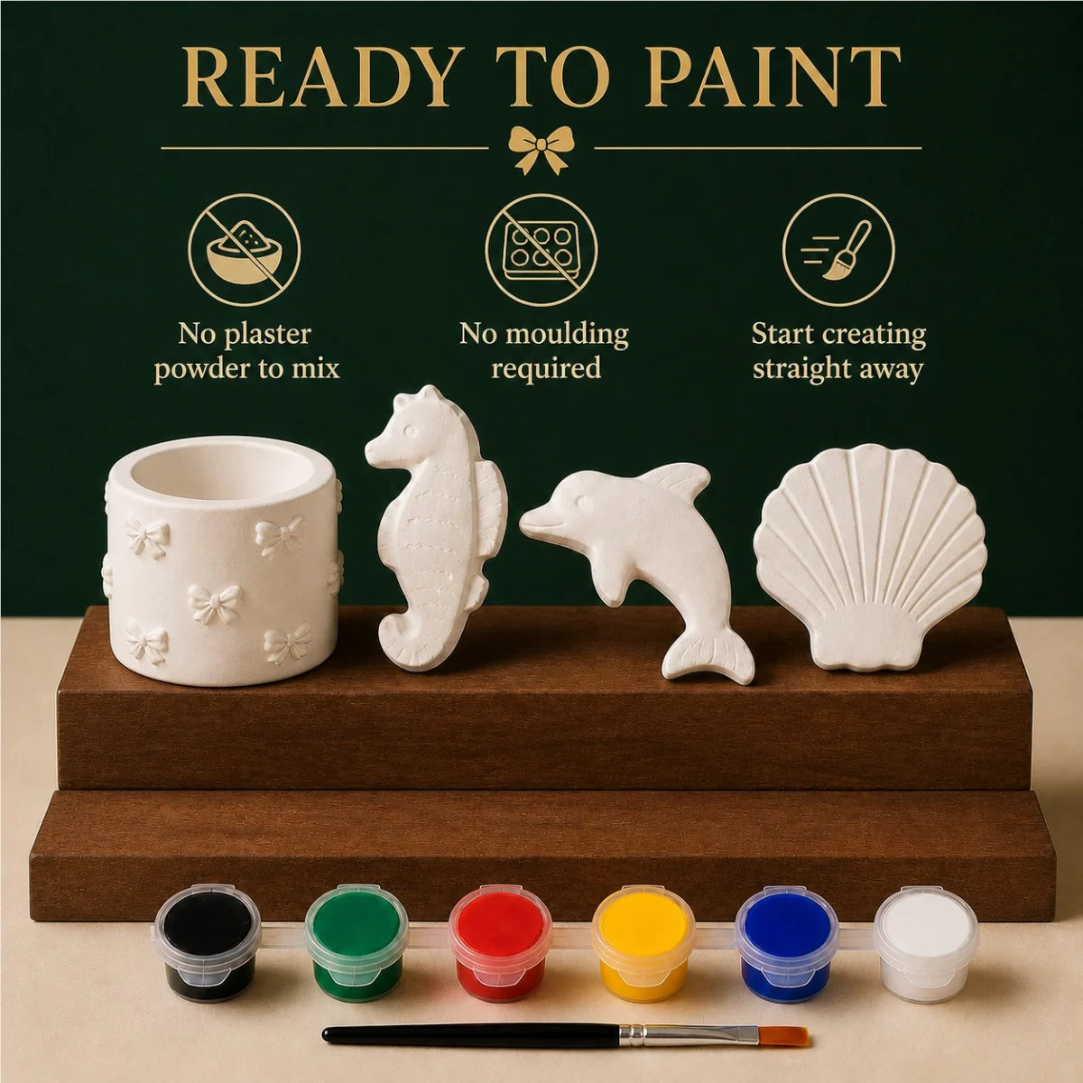 The pieces being painted at a table