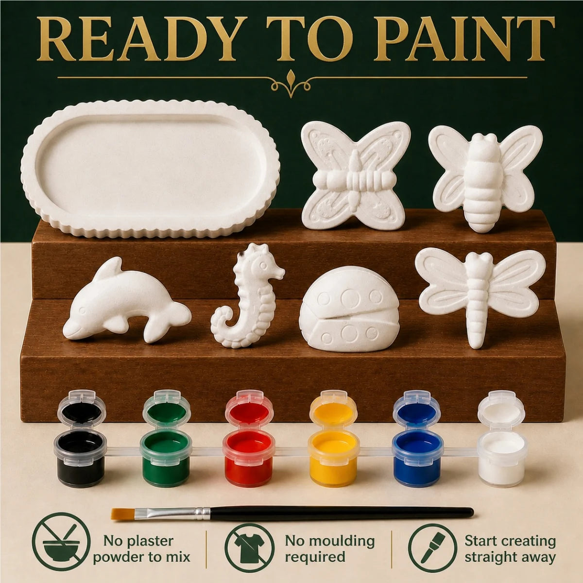 The pieces being painted at a table